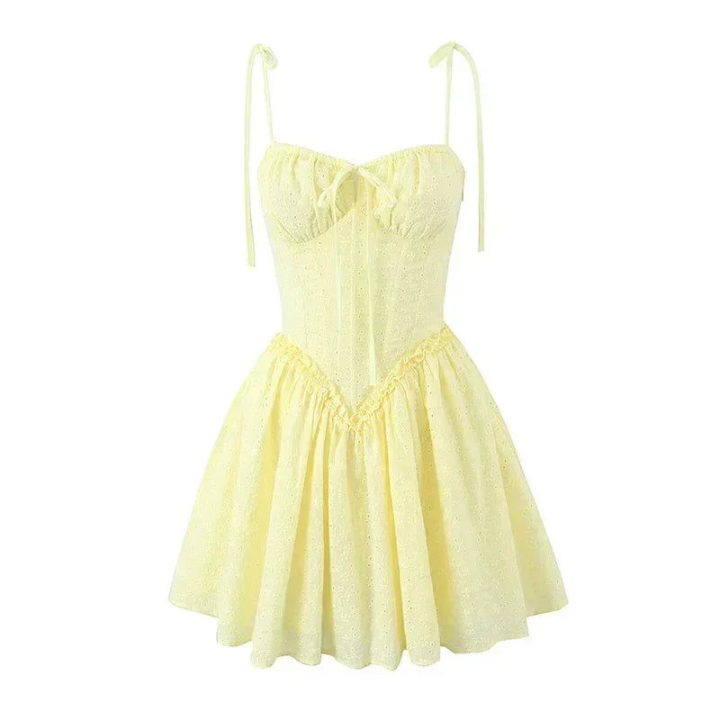 YENKYE Sexy Elegant Women Hollow Out Embroidery Yellow Sling Mini Dress Low Waist Lace Up Bandage Party Dresses Birthday Robe